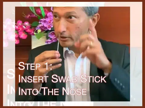 新加坡外交部长亲自示范讲解快速抗原检测（Antigen Rapid Tests，简称ART）。（维文面簿视频截图）