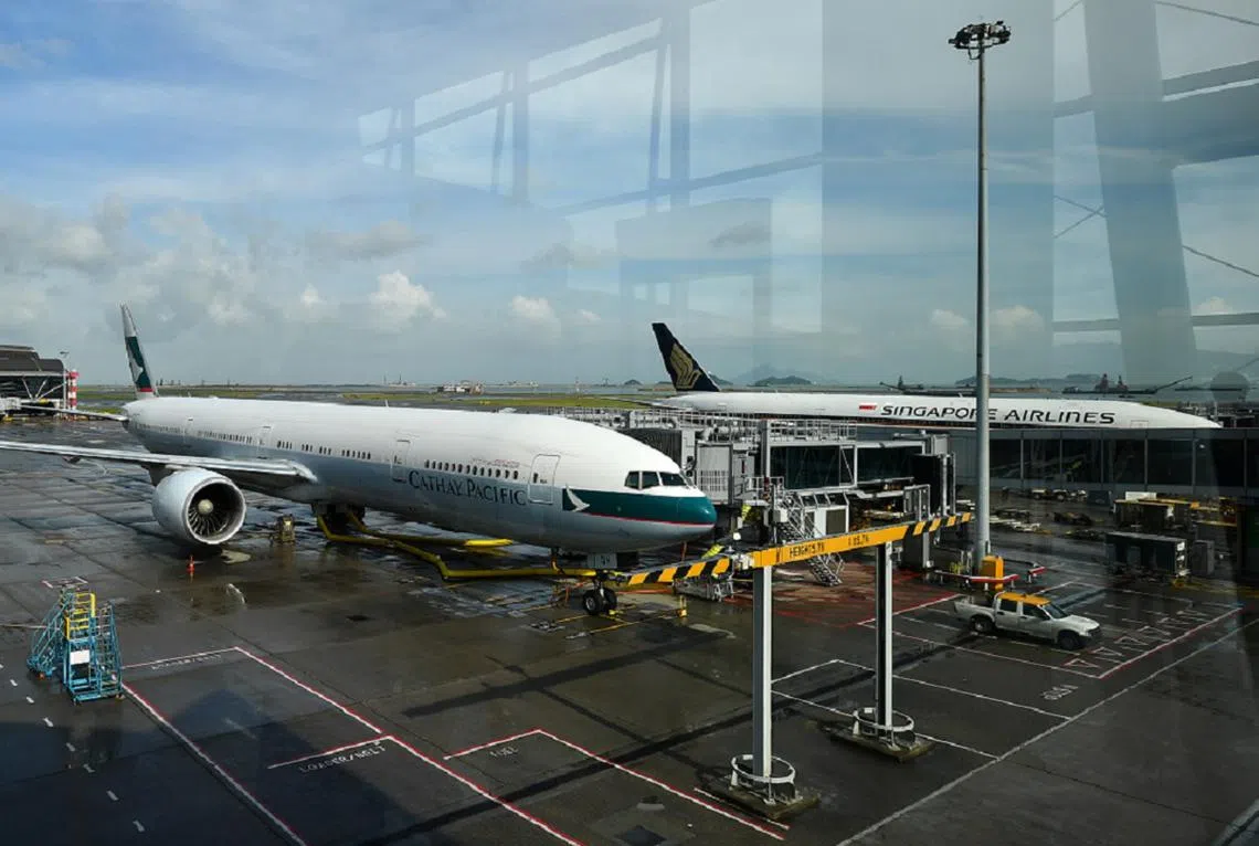 新航国泰排排坐。（海峡时报）