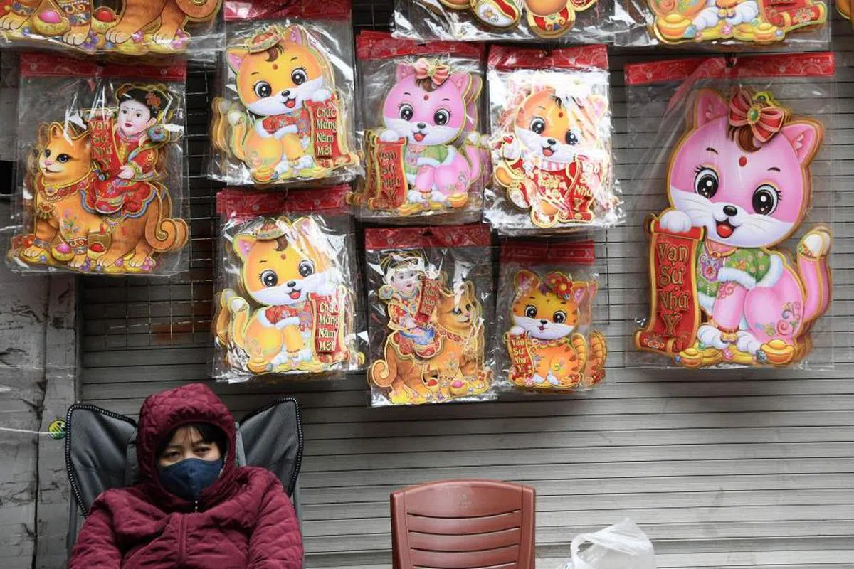 可爱猫咪荣登新年装饰主角，这在本地和其他华人地区应该殊难想像。（法新社）