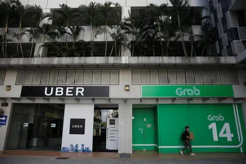 Uber与Grab在新加坡办公室。（路透社） 