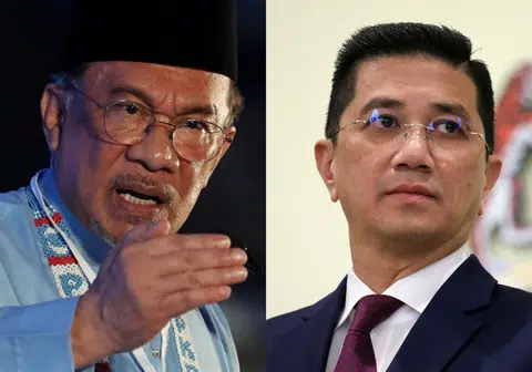 阿兹敏（右）针对部分州属不遵守联邦政府政策的言论引起安华（左）不满。（李国豪制图）