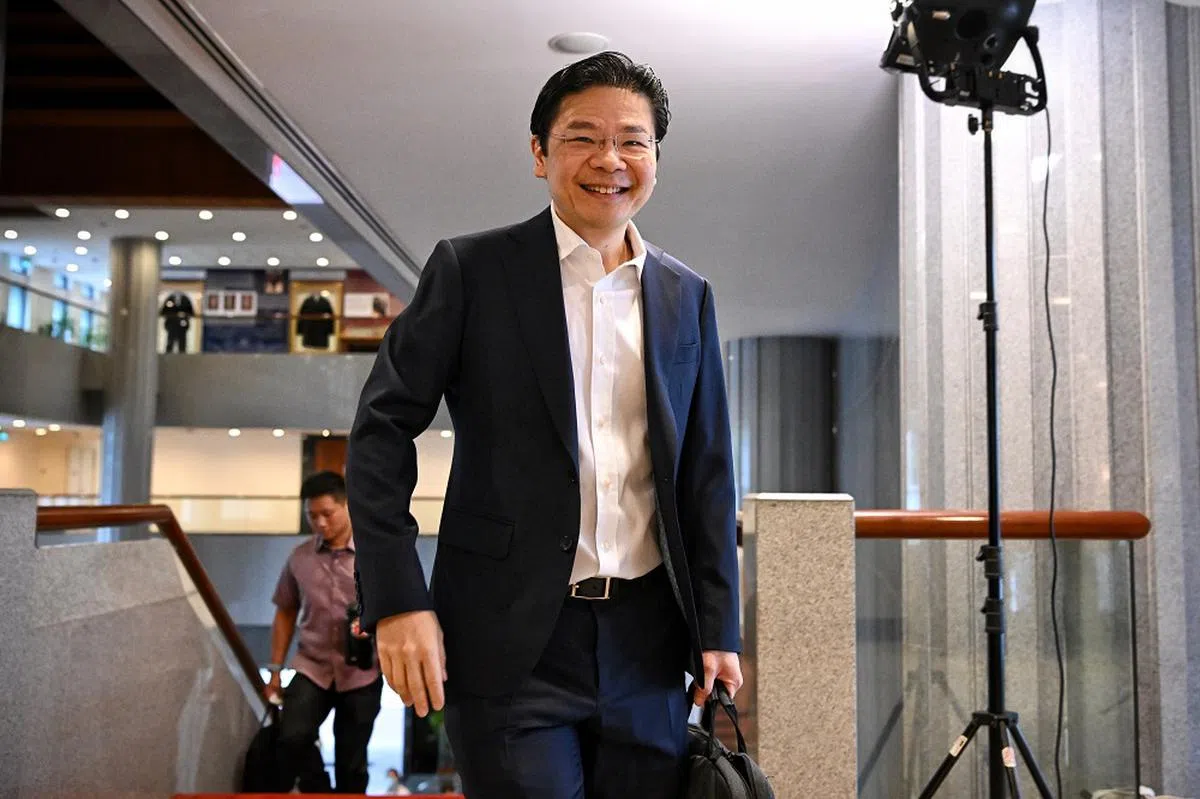 副总理兼财政部长黄循财2月14日抵达国会大厦，准备发表本财政年度预算案声明。（海峡时报）