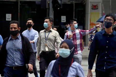 商业区白领员工。（联合晚报）