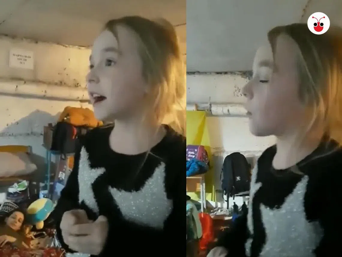 在防空壕内为同胞们献唱《Let It Go》的7岁乌克兰女孩Amelia。（视频截图 / 红蚂蚁制图）