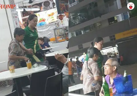 啤酒妹搀扶着阿嫲回到座位。(STOMP)