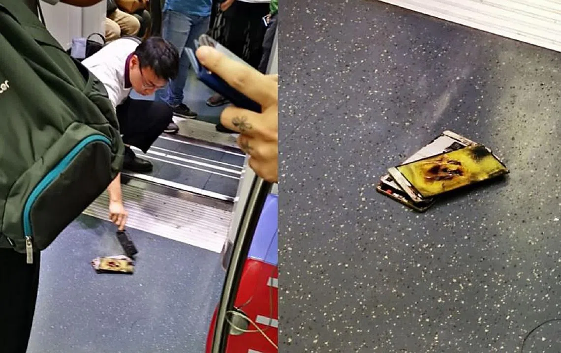 地铁职员小心翼翼地处理手机。（海峡时报）