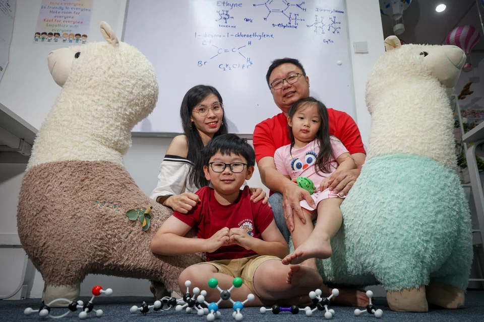 Theodore with his parents, Madam Crystal Tang and Mr Kwan Jung Hong, and his three-year-old sister Tabitha.