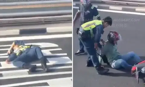 Certis officer lies on road after accident with motorcyclist at Tuas Checkpoint