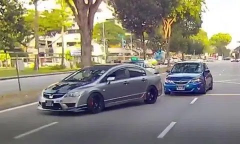 Honda driver stops car and blocks traffic after cabby cuts him off along Lavender Street