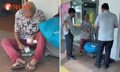 Tissue paper seller counting money outside Bukit Batok MRT station approached by SMRT staff