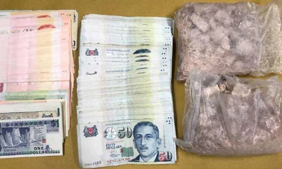Drugs and cash seized in an operation on April 11, 2017. PHOTO: CENTRAL NARCOTICS BUREAU
