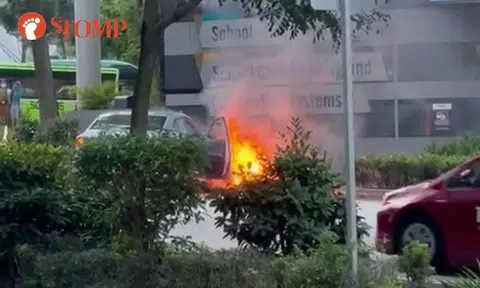 E-bike on fire after accident with car outside SMU, rider taken to hospital