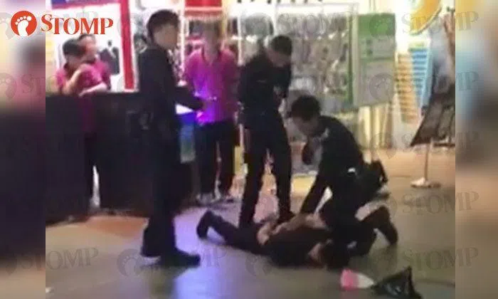 43-year-old man pinned down and arrested by Police at Tampines Bus ...