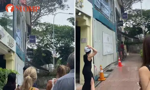 Water pours from top of Holland Village shophouse under renovation like it's raining