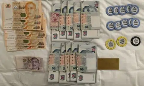Over $140,000 worth of casino chips and cash seized in police operation at MBS casino, 9 arrested