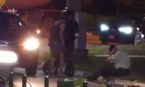 Toyota driver sits on ground in pain after PMD rider allegedly punches him at SLE exit