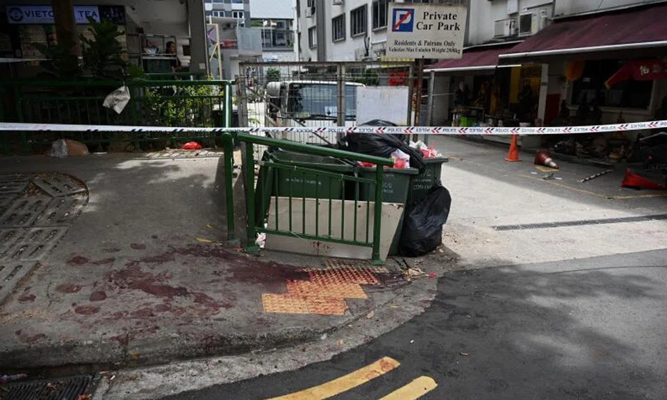 A private carpark next to a religious association in Geylang Lorong 16 was cordoned off by the police, with bloodstains seen on the pavement next to a rubbish bin.