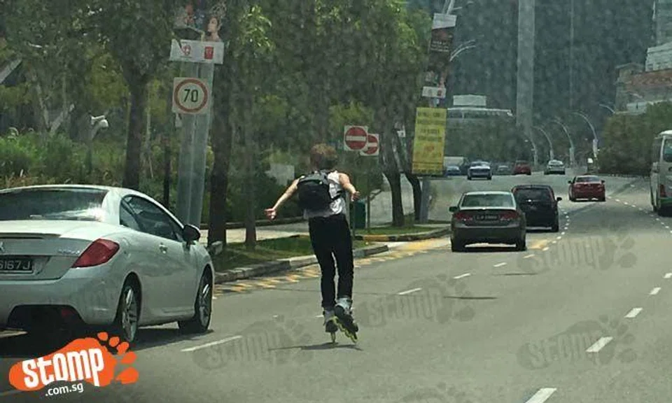 What is this person thinking, roller blading in the middle of Nicoll Highway?