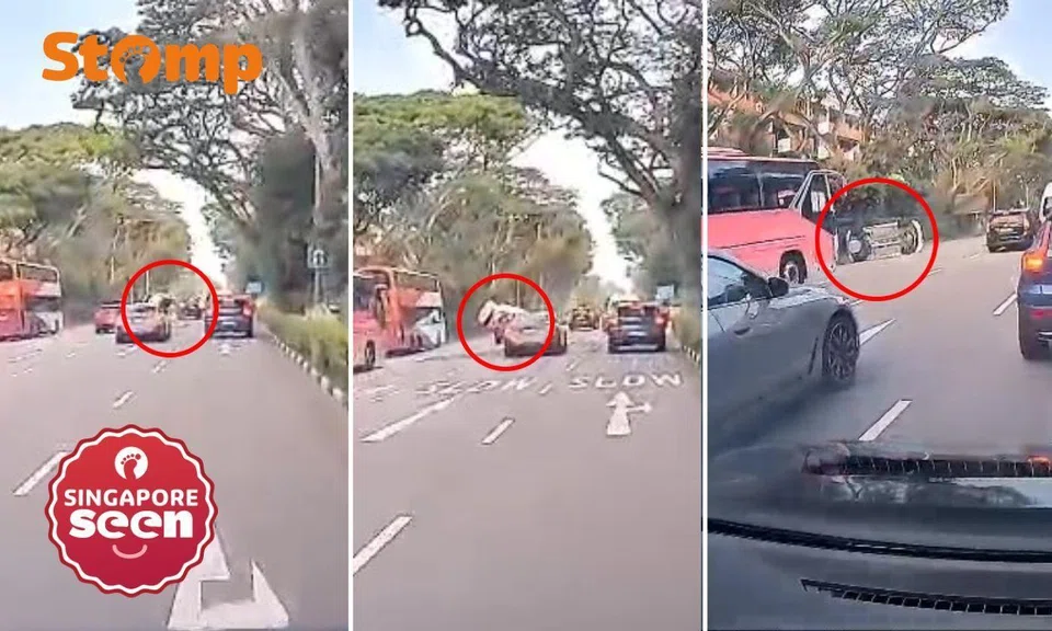 White car flung into air after collision with black car at Bukit Timah Road