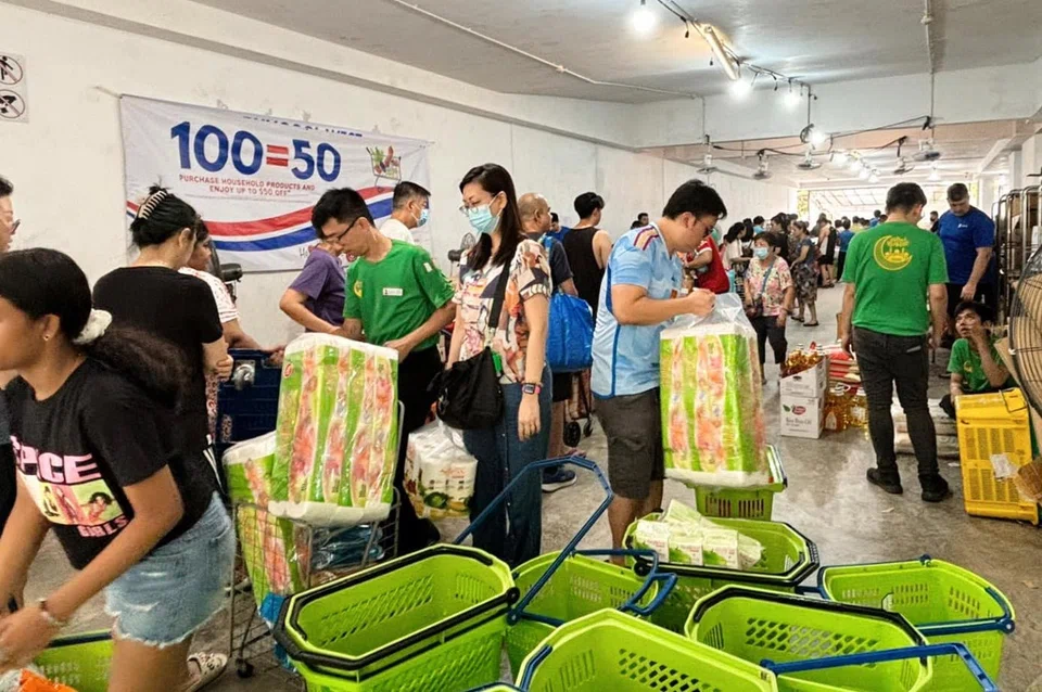 Punggol West residents participating in a half-priced grocery shopping session in March 2024. 