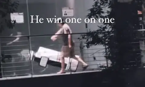 Bystanders laugh as man starts bizarre 'fight' with cleaning robot in CBD