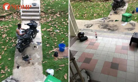 Guy working on motorbike leaves spray paint marks on walkway at Stirling Road