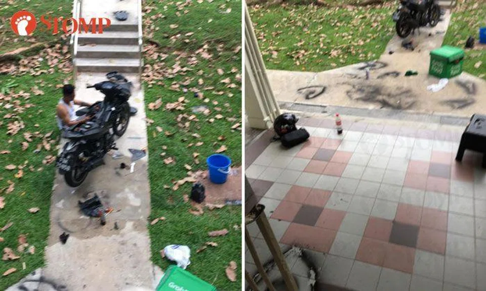 Guy working on motorbike leaves spray paint marks on walkway at Stirling Road
