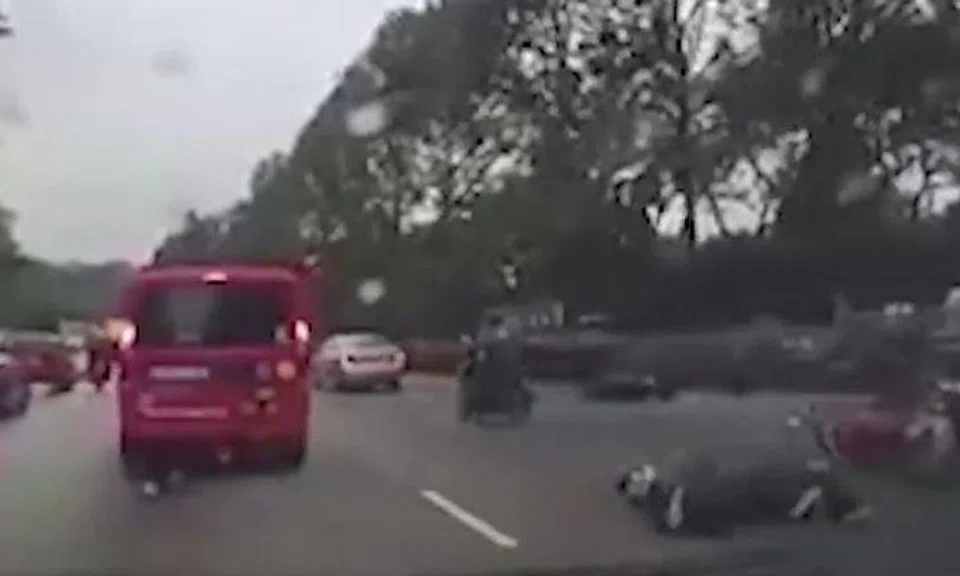 2 bikers skid on expressway after trying to avoid car that changed lane