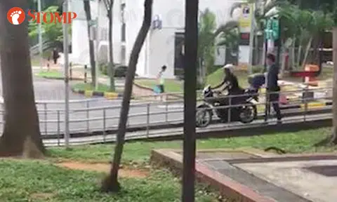 Biker rides on pedestrian pavement to avoid paying fee at carpark gantry