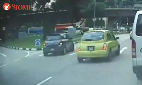 Suzuki driver reverses on main road after missing left turn in Boon Lay