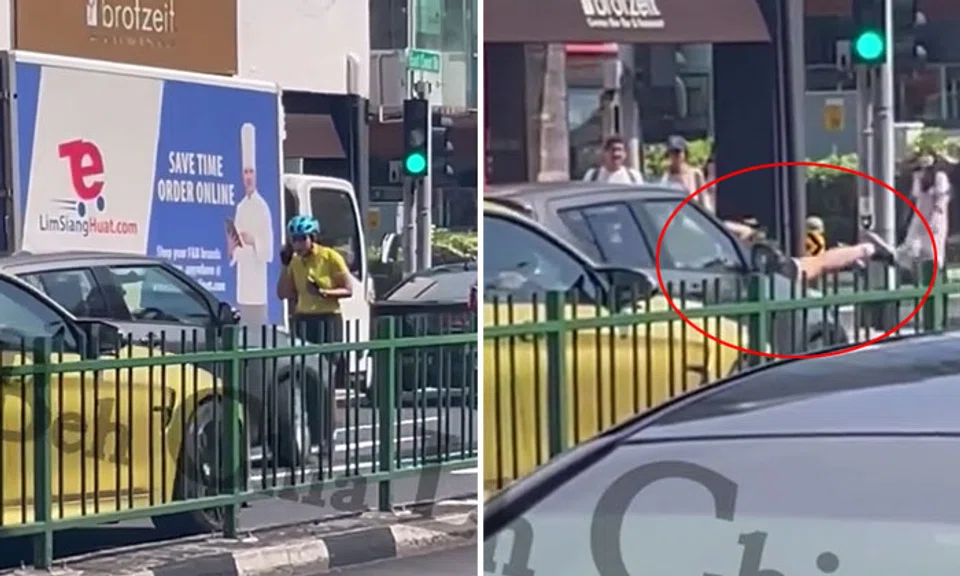 Footage on social media showed a grey car driving off with a female cyclist clinging onto it after the cyclist obstructed the driver's path. PHOTOS: SGKAYPOHLAH/FACEBOOKFootage on social media showed a grey car driving off with a female cyclist clinging onto it after the cyclist obstructed the driver's path. PHOTOS: SGKAYPOHLAH/FACEBOOK