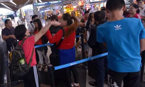 China and HK tourists hold protests at KL airport to demand flights home after Typhoon Hato
