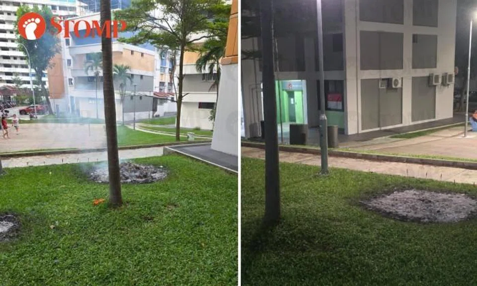 Burnt offerings on grass in Serangoon North Avenue 1