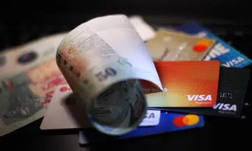 Sharing credit card details or OTP in scams is not gross negligence, but ignoring repeated warnings is, said the Small Claims Tribunal.