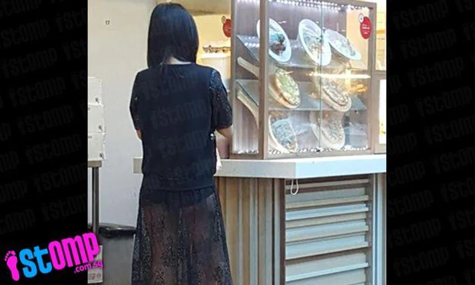 Fashion trend or wardrobe malfunction? Woman's translucent skirt leaves passers-by at Lot 1 baffled