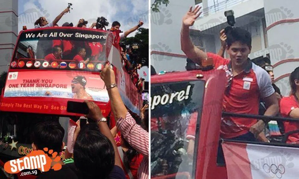 Crowds cheer as Joseph Schooling goes on victory parade around Singapore