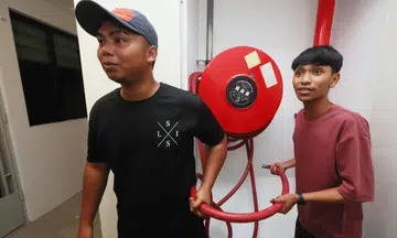 Brothers rush to save Yishun flat after mattress catches fire, battle flames with hosereel