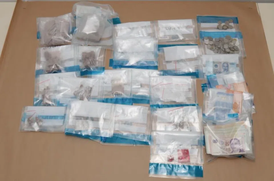 Drugs and cash recovered from a raid on residential unit in the vicinity of Chin Swee Road on Feb 11. 