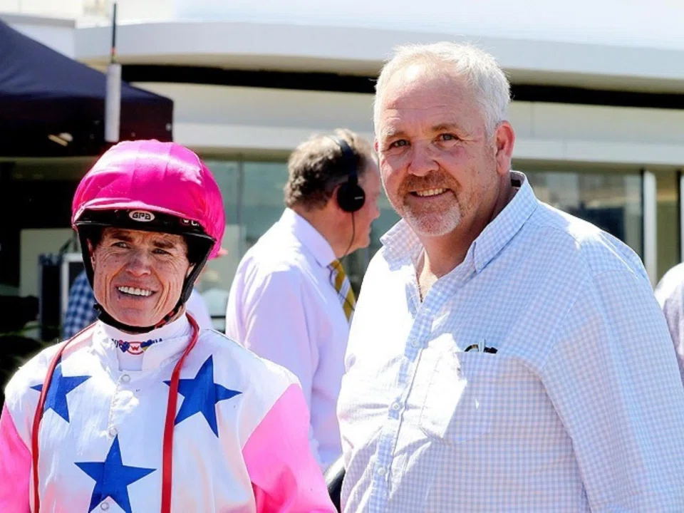 Cliff Brown chatting with jockey Craig Williams before a race in Australia. Williams dons the Barree silks made famous at Kranji by Brown's Debt Collector and Inferno.
