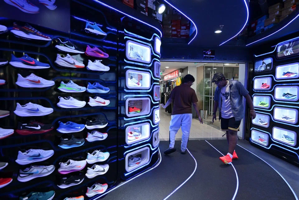 Customers shopping for sports shoes at Queensway Shopping Centre on May 27.