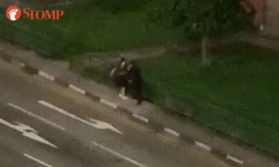 Man hits woman multiple times during tussle in Geylang