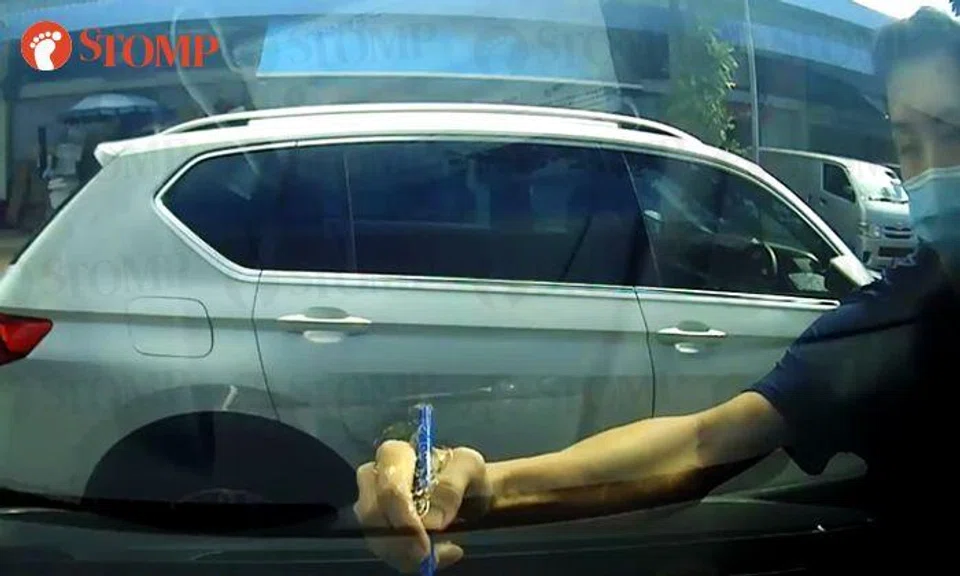 Neighbour scribbles 'Please Do Not Park Here' on man's car with permanent marker