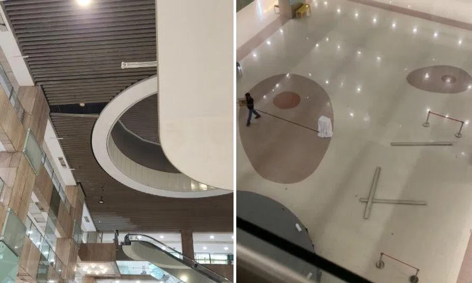 The woman was sitting on a red bench at the edge of the concourse when the grey beams crashed onto the floor mere metres from her. Photos: The Straits Times 