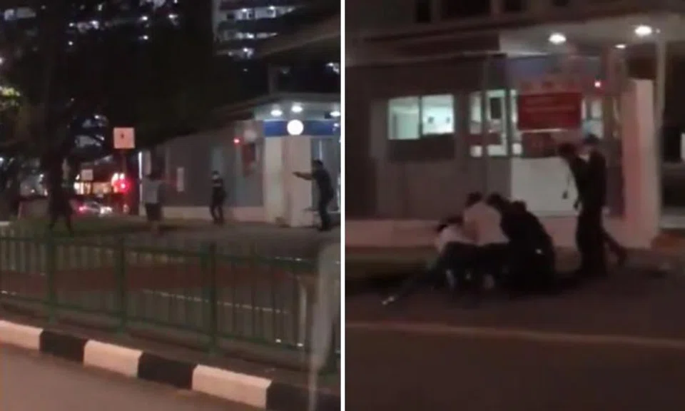 A video posted on Facebook shows the man walking across the road towards three uniformed police officers, holding a knife in his right hand. PHOTOS: SCREENGRABS FROM BENNY TAN/FACEBOOK