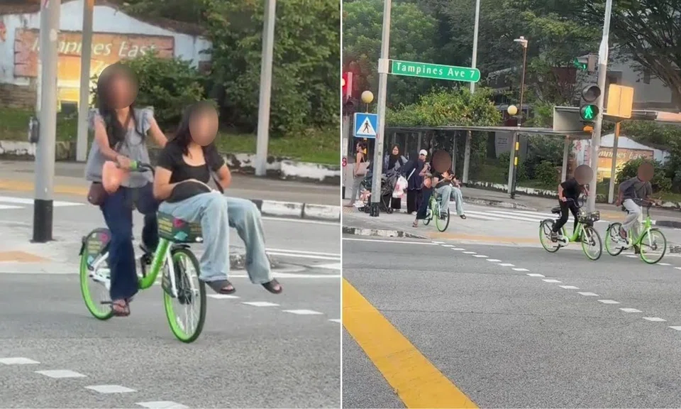 A woman was seen riding with a passenger in the front basket of an Anywheel bicycle.