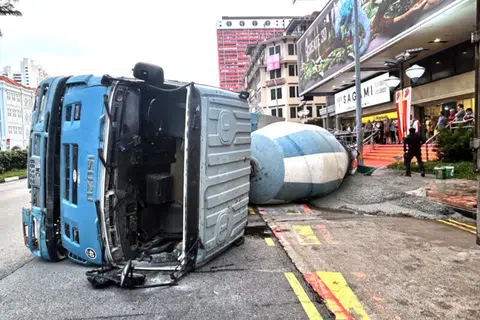 Cement truck overturns in Chinatown, spilling cement on pavement