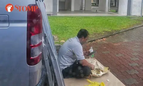 Woman sad to see worker eating lunch on road in Sembawang HDB estate: 'It looked very inhumane'