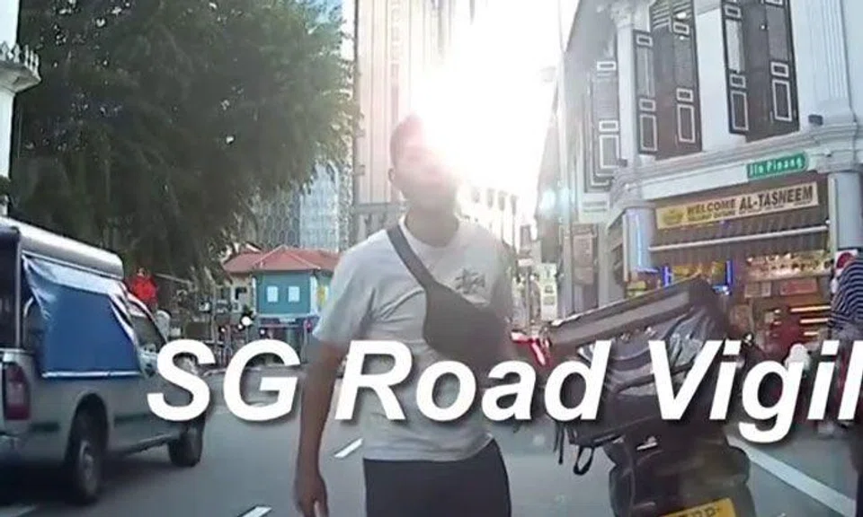 Motorcyclist spits on parked car at North Bridge Road -- but why?