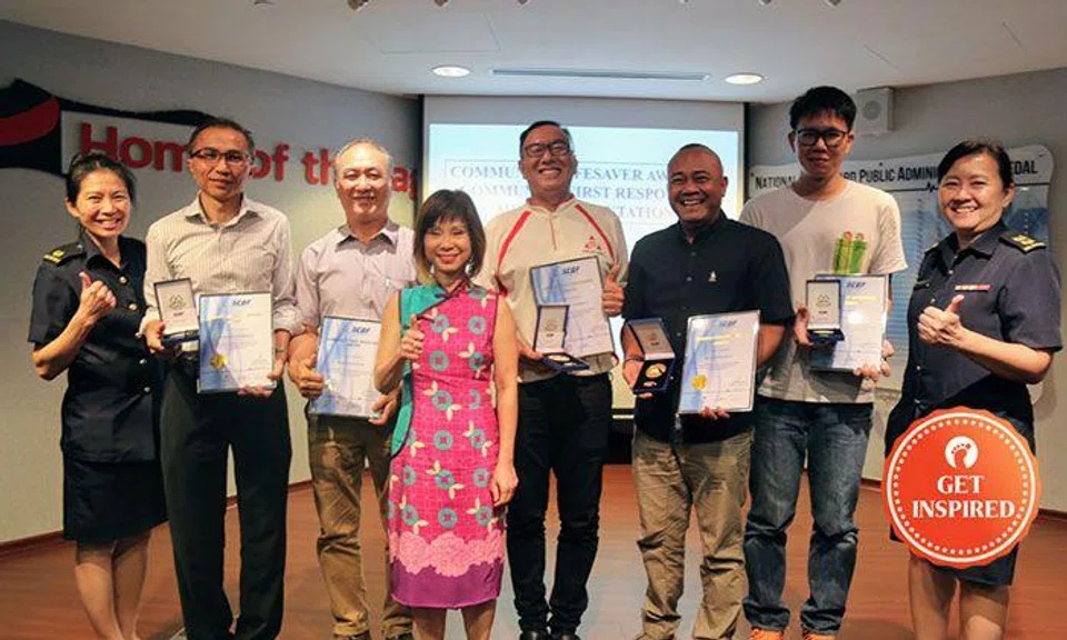 Recipients of the Community Lifesaver and Community First Responder Awards. From Left: MAJ Chia Peng Peng, Mr. Chew Ho Kiat Raymond, Mr. Wong Kuek Phong, Dr. Amy Khor, Mr. Ng Kheng Yong Danny, Mr. Asnadi Bin Robani, Mr. Billy Lim Kuang Lee and LTC Betty Ting