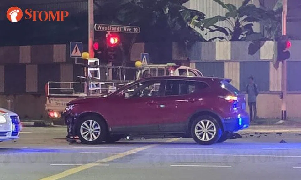 Lorry driver taken to hospital after accident with car at Woodlands junction